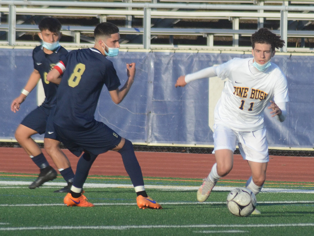 Pine Bush’s Michael Dempsey moves the ball during Wednesday’s OCIAA boys’ soccer game at Newburgh Free Academy.